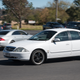 The iconic Ford AU Falcon and a Mercedes CLS which was inspired by the AU Falcon.